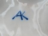 a white plate with a blue and white design on it