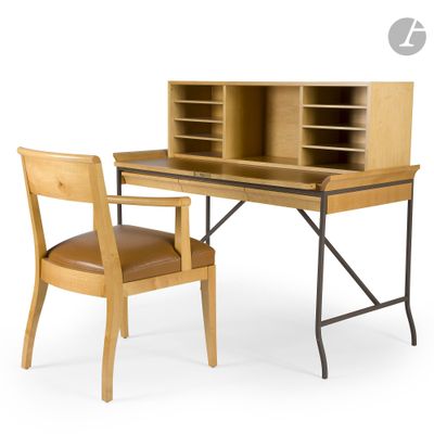 a desk with a chair next to it and a bookcase