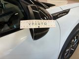 a white car with a ticket attached to it ' s side mirror