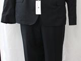 a black suit on a mannequin on a stand