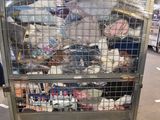 a large metal cart with many items inside of it
