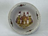 a small bowl with a picture of a castle on it