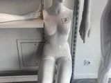 two mannequins that are sitting next to each other
