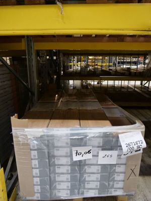 a pallet with a lot of boxes on it in a warehouse