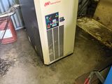 a water heater that is sitting in a garage