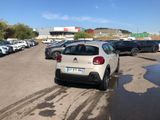 many cars parked in a parking lot in a lot