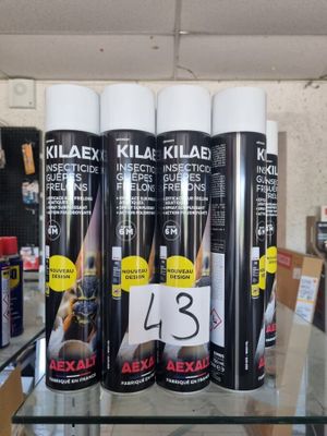 several cans of klax are on a glass table in a store
