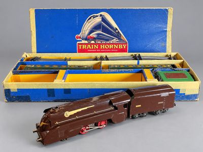 an old toy train engine in a box with a train hornby logo