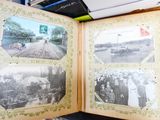 an open book with pictures of people on it