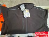 a picture of a jacket and other items laid out on a table
