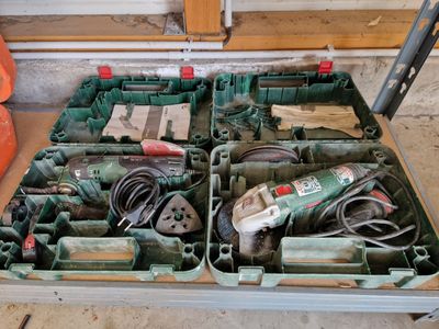 many tools in the box on the floor