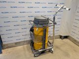 an image of a vacuum on a cart in front of a wall