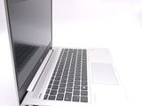 a laptop computer that is sitting on a white table