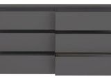 a close up of a dresser with four drawers on it