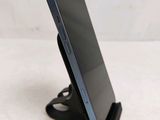 a cell phone that is sitting on top of a stand