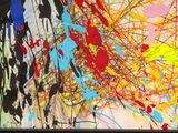abstract painting of multicolored paint splattered on a white wall