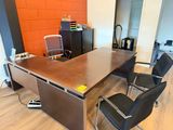 an image of an office with a desk and chairs