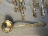 a lot of silver spoons and spoon spoons on a table