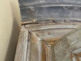 a close up view of a corner of a room with a mirror