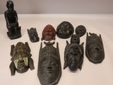 many different types of african masks on a table