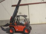 a picture of a forklift parked in front of a building