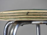 a close up of a surfboard sitting on a stool