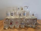 a lot of beer glasses sitting on a table