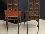 two chairs sitting next to each other on the floor