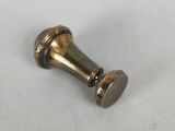 an antique brass door knob on a white surface