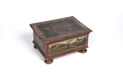 an old wooden box with a painting on it on a white surface