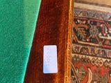 a small sticker on the edge of a pool table