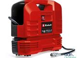 un compresseur d'air portable rouge muni d'un tuyau