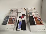 three boxes of cell phones sitting on top of a white table