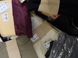 a pile of clothing that is sitting on the floor