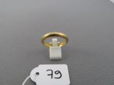 a picture of a gold ring with a price tag attached to it