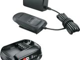 un chargeur de batterie et un cordon d'alimentation pour ce chargeur