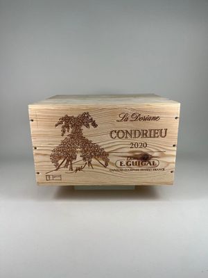 a wooden box with a horse on it sitting on top of a table