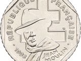 the coin has a picture of a man in a hat and a cross on it