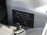 a close up of a car ' s engine with a label on it
