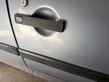 a close up of a door handle on a car