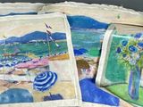 trois sacs sur lesquels figurent des images représentant une scène de plage