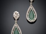 a pair of emerald and diamond earrings