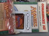 a box of cards sitting on a table next to a bag of cards