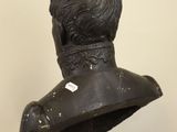 bust of a man with a collar on a pedestal