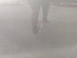 a person that is walking in the rain with an umbrella
