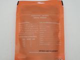 a bag of orange food sitting on top of a white table
