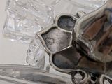 a close up of a silver object on a table
