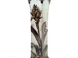 a tall vase with a painting of a plant on it