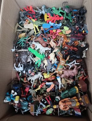 a box full of assorted toy animals in it