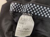 a close up of a label on a black jacket